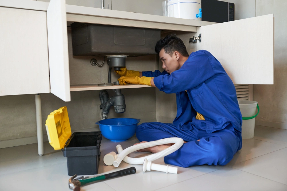 Plumber fixing leaks in Penhook VA