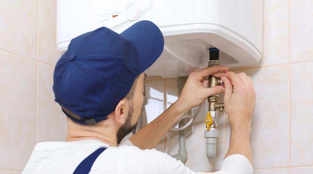 Expert plumber from Plumbing Champions fixing pipe in Penhook VA