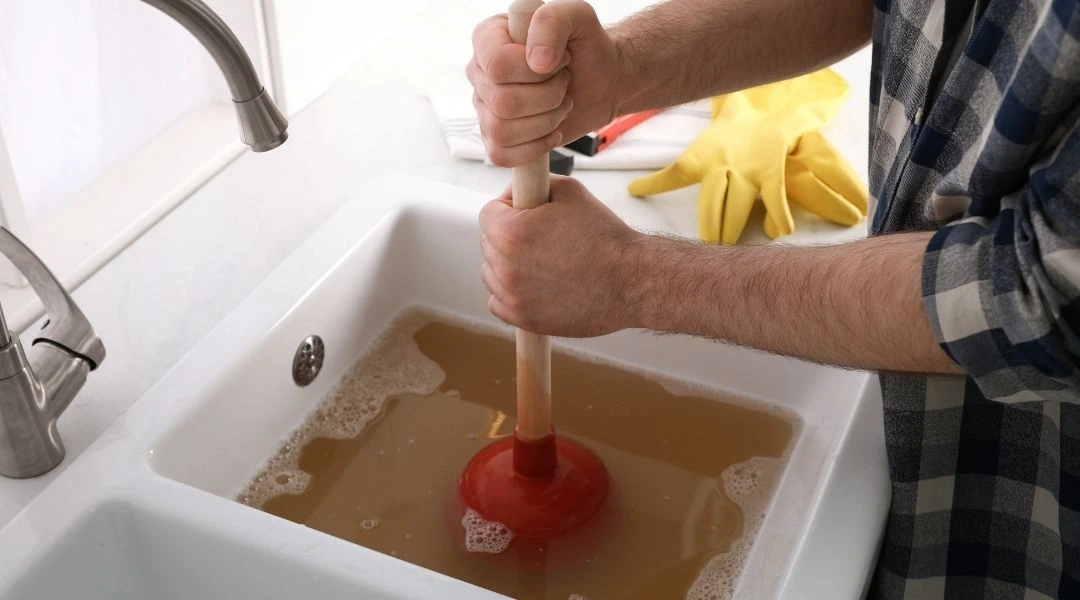 Professional plumber from Plumbing Champions installing faucet in Penhook VA